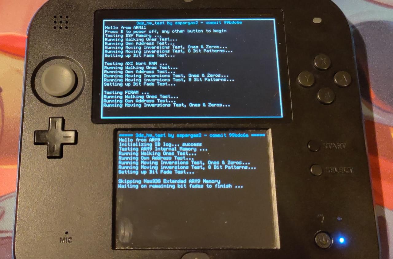The 2DS showing on both screens a different log describing the tests that are currently being made
